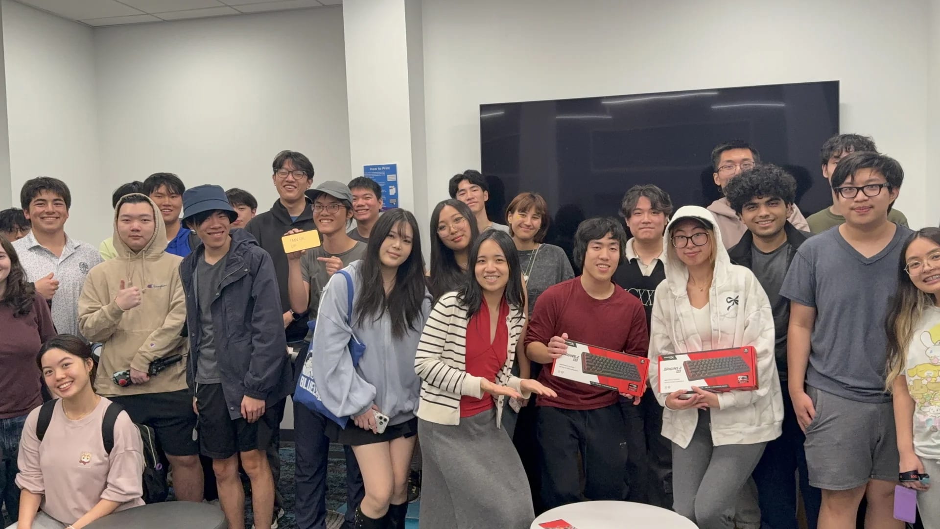 The LEVEL UP! VALORANT community posing together with prizes