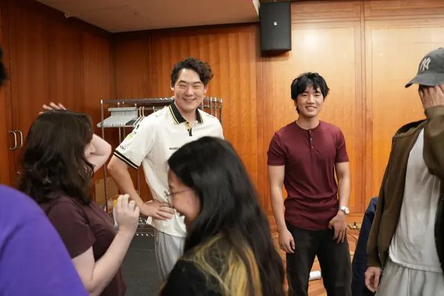 Attendees talking with Arnold Hur after the Gen.G fireside chat